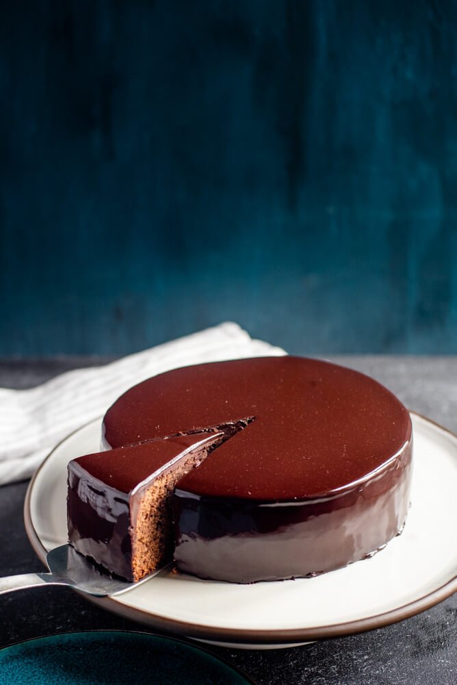 Black Forest mousse chocolate cake with red mirror glaze and fresh  cherries. A modernized classic dessert Stock Photo - Alamy