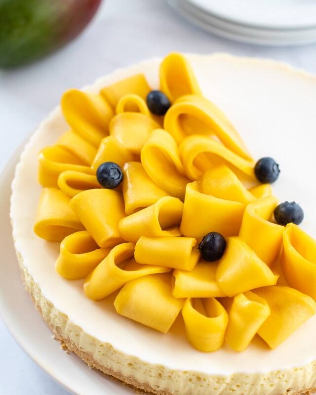 No-bake mango coconut cheesecake with fresh mango - hero
