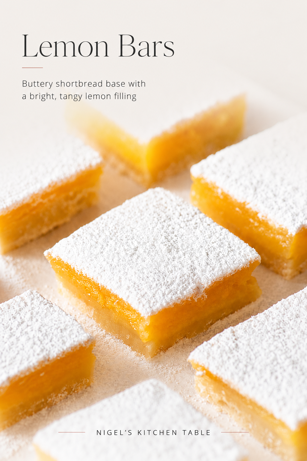 Lemon bars with a buttery shortbread base and bright lemon filling, dusted generously with icing sugar.